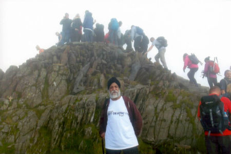 Manager scales Scotland's highest peak to raise cash