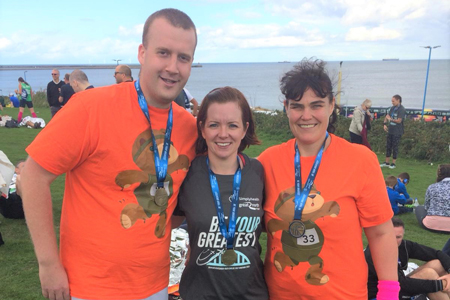 Staff complete 13 mile charity run