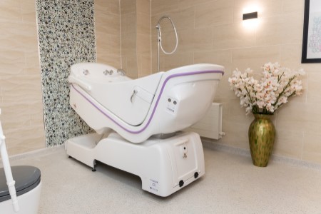 Virus protection integrated into reclining bath 